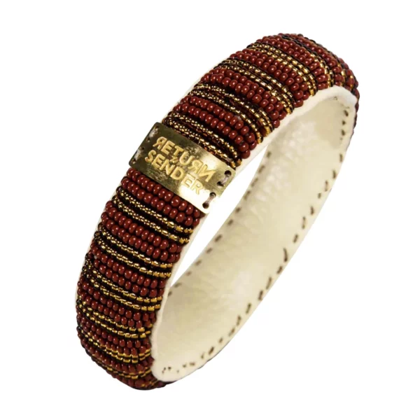Goud met rode armband