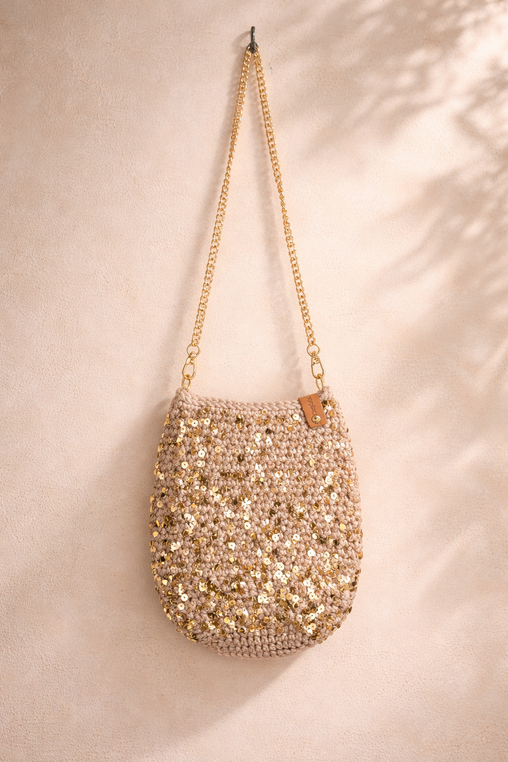 Glitter schoudertasje champagne